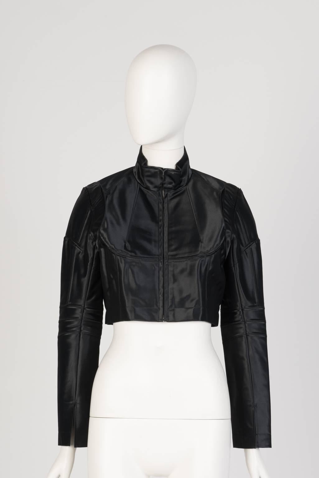 Fitted, high waist, nylon moto jacket with satin-like sheen, zip front, slit cuffs, and  complex seaming detail.