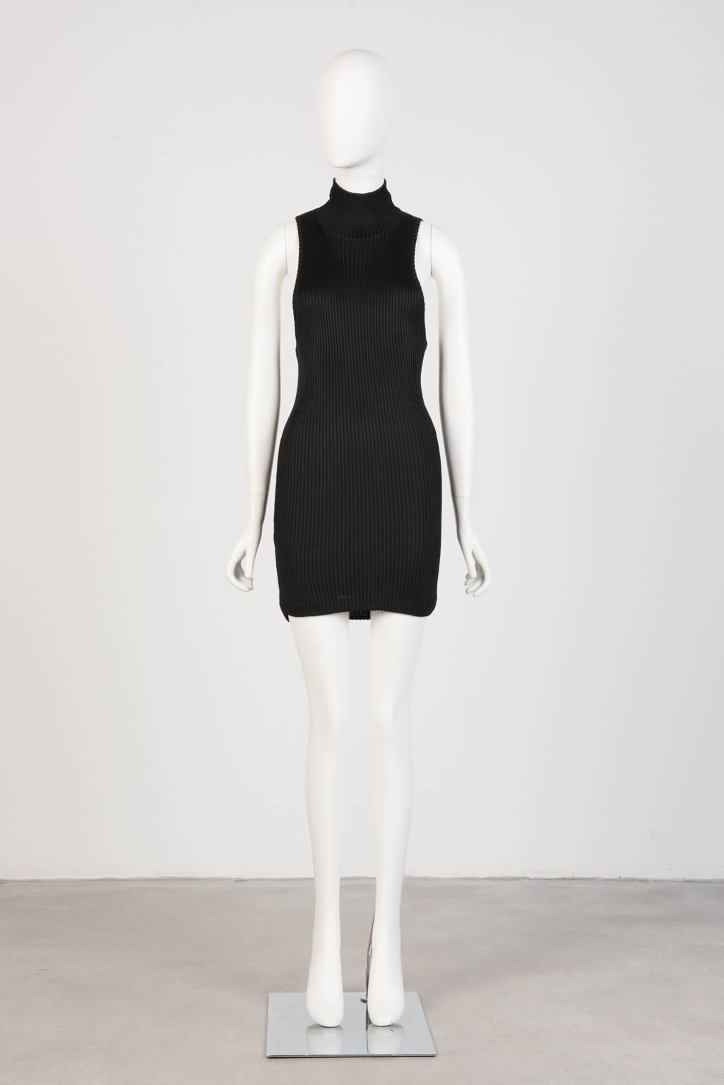 Sleeveless, turtleneck mini dress with low cut arms in heavy, stretch ribbed knit