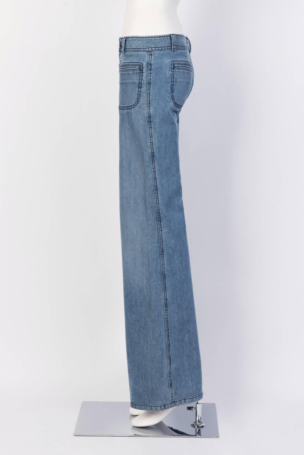 Chloé low waist flair jeans in washed cotton denim. 
