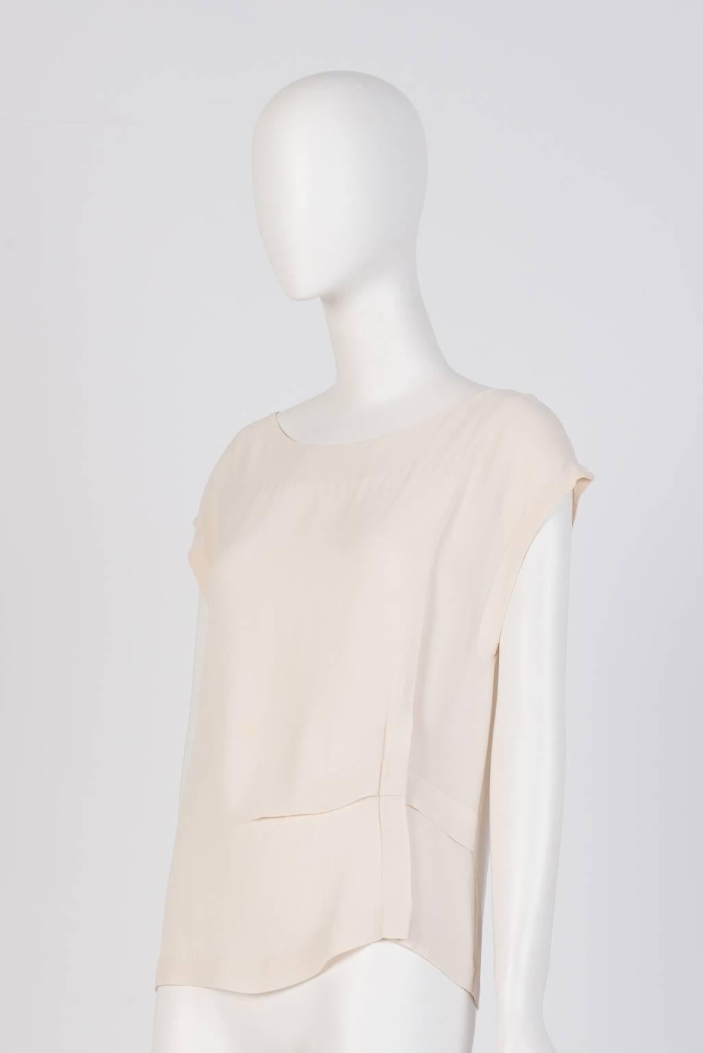 Dries Van Noten cap sleeve T-shirt in crepe fabric with a cross pleat detail on the low left. One minor tear around the right shoulder, please refer to image.