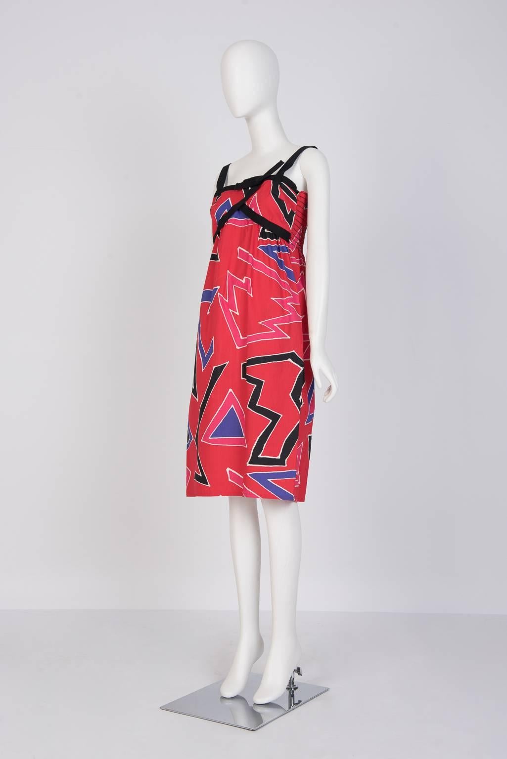 80's graphic print sundress with contrast black shoulder straps that continues around the bodice and smocked back detail