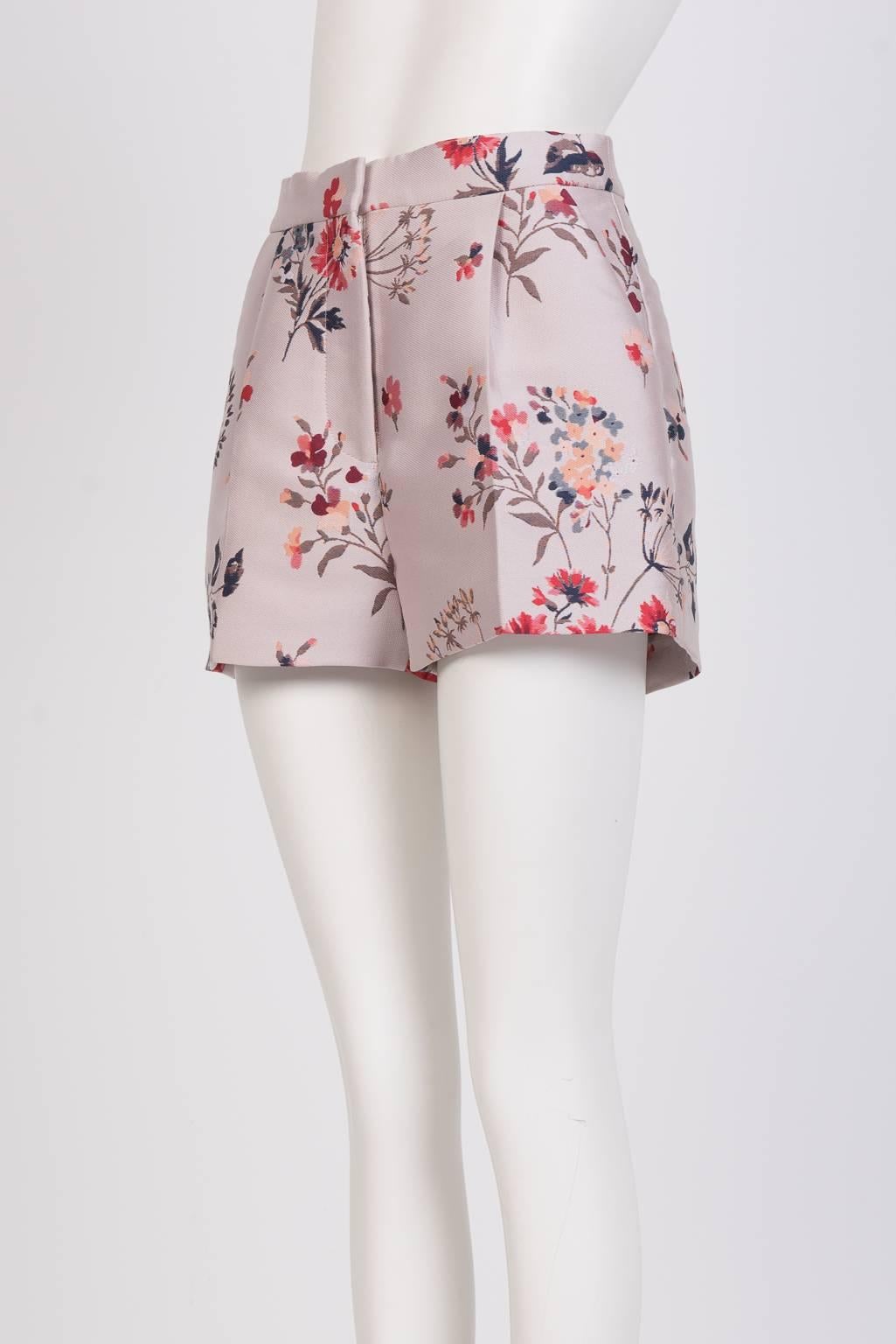 Floral brocade  mini-shorts with pleated front and men's trouser details.