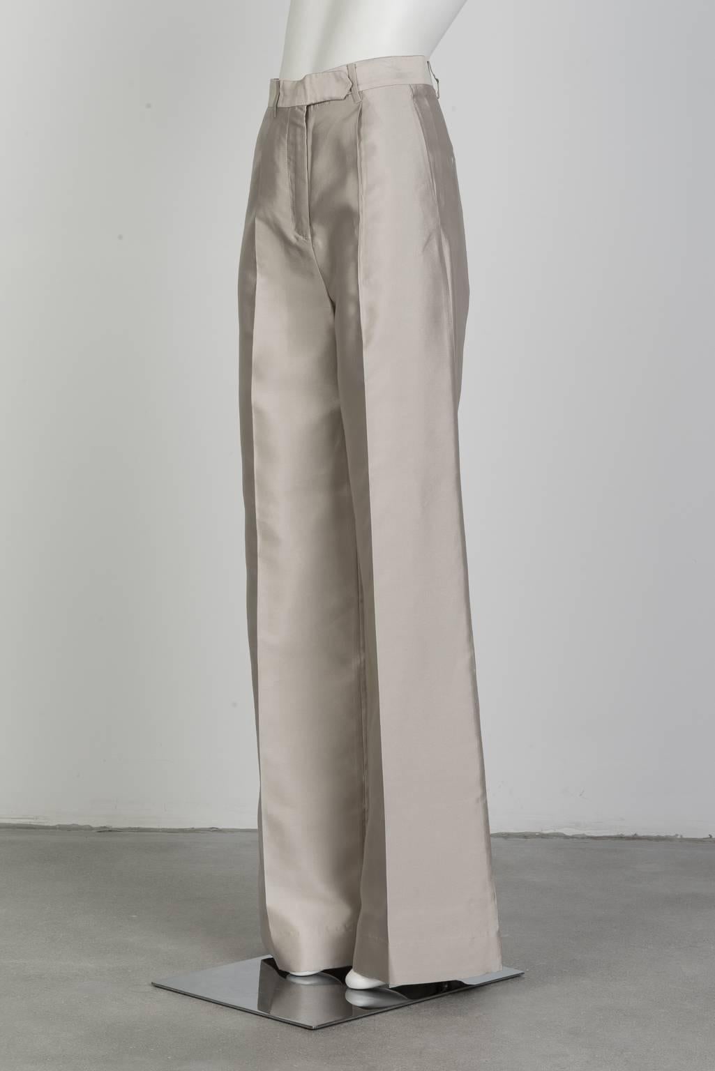Classic high waist, wide leg trouser with back pockets in champagne colored structured silk.