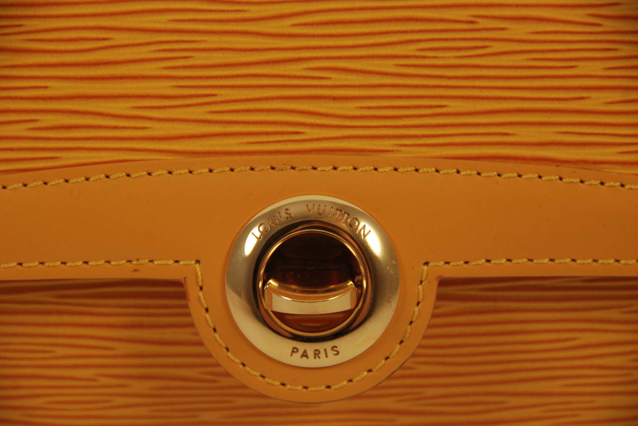 Louis Vuitton Mustard Yellow Epi Leather Arche Clutch In Excellent Condition In New York, NY