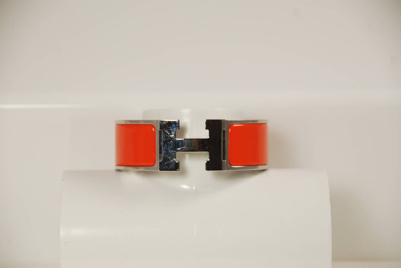 Hermes enamel Clic H bracelet. Silver and palladium plated hardware and orange enamel. Bracelet diameter 2.25