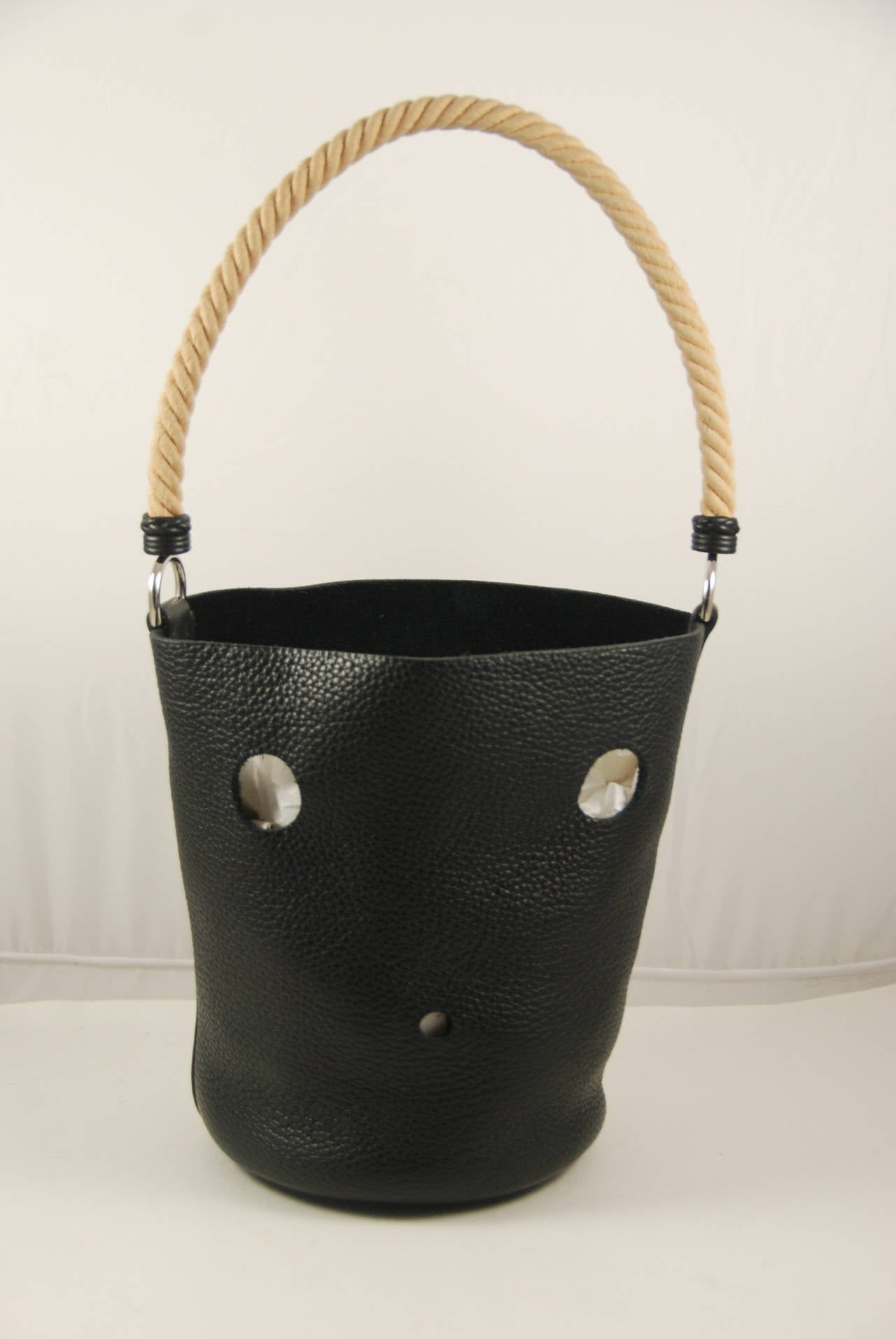 Hermes black clemence leather Mangeroire bucket bag from 2005. The handle is twisted rope and long enough to be tucked under your shoulder or used as a handbag. The strap has a 9