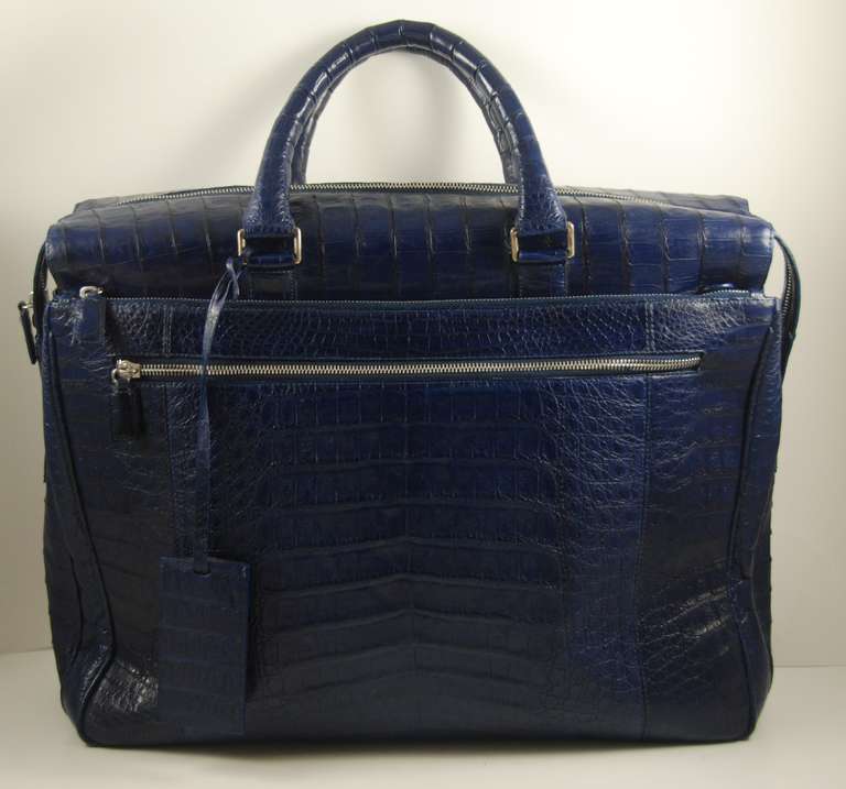 Royal blue Caiman crocodile briefcase by Santiago Gonzalez. This is the men's line of the luxury brand Nancy Gonzalez, which is designed by her son Santiago. Same great crocodile as used in Nancy Gonzalez bags. This briefcase is fabulous! Santiago's