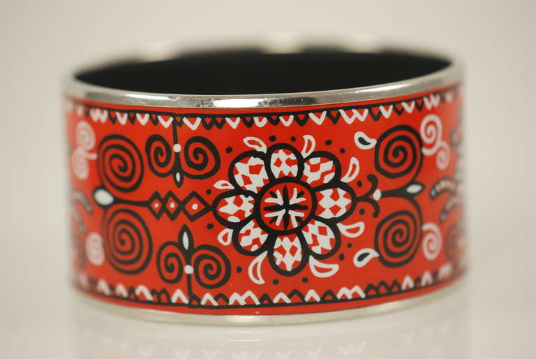 Contemporary  1.5 inch wide Hermes enamel bracelet in red, black and white with palladium plated trim. 2.5