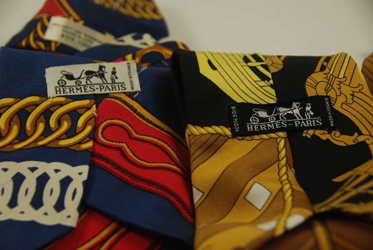 Three wonderful examples of the ties made by Hermes in the 1970s. This line of ties was made of actual Hermes scarves by Hermes. They are 100% silk and hand stitched. Great as ties or used as belts.