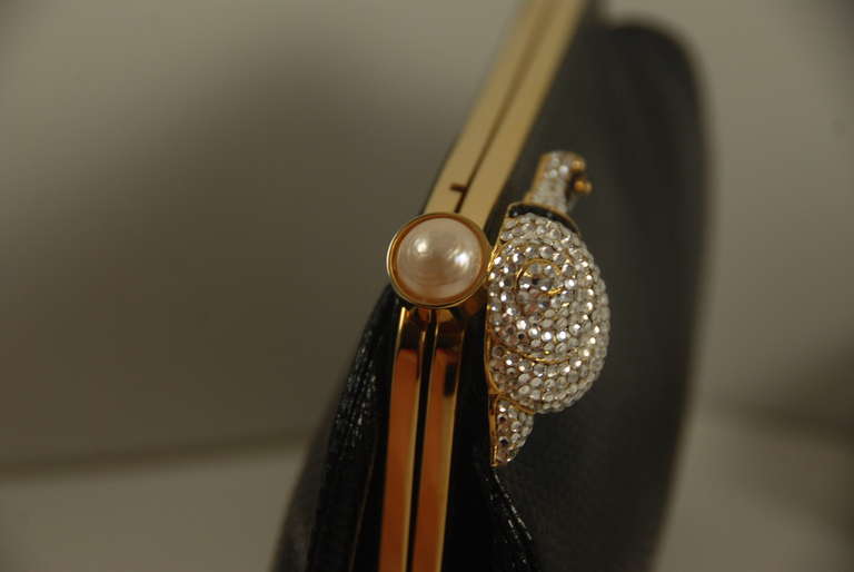 1980s Judith Leiber Black Karung Clutch with Rhinestone Snail Clasp In Excellent Condition In New York, NY