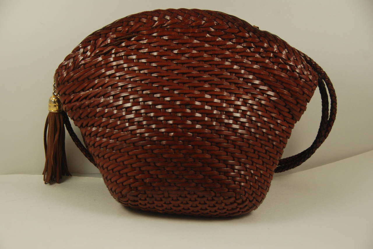 Brown leather woven T. Anthony shoulder bag from the 1980s. T. Anthony is a prestigious leather goods store on Park Ave. in New York City. Now they are famous for their luggage but until about 5 - 10 years ago they had a full line of ladies handbags