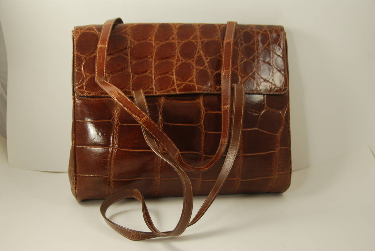 Timelessly elegant very large brown alligator shoulder bag by Prada. Skins are supple. The shoulder straps have a 13