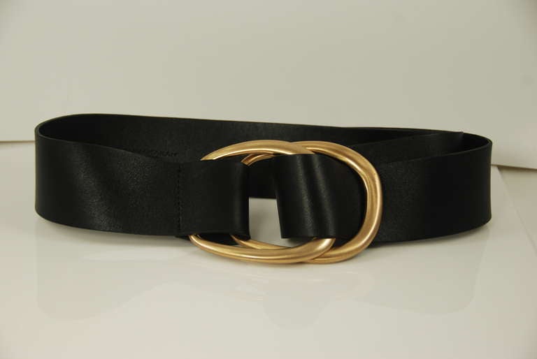 Donna Karen black leather belt with matte finish gold buckles. Belt is a size large. The buckles are approximately 4