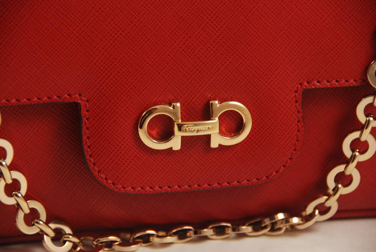 Ferragamo red textured calfskin flap bag with gold chain. The chain has an approx. drop to the top of the bag of 7