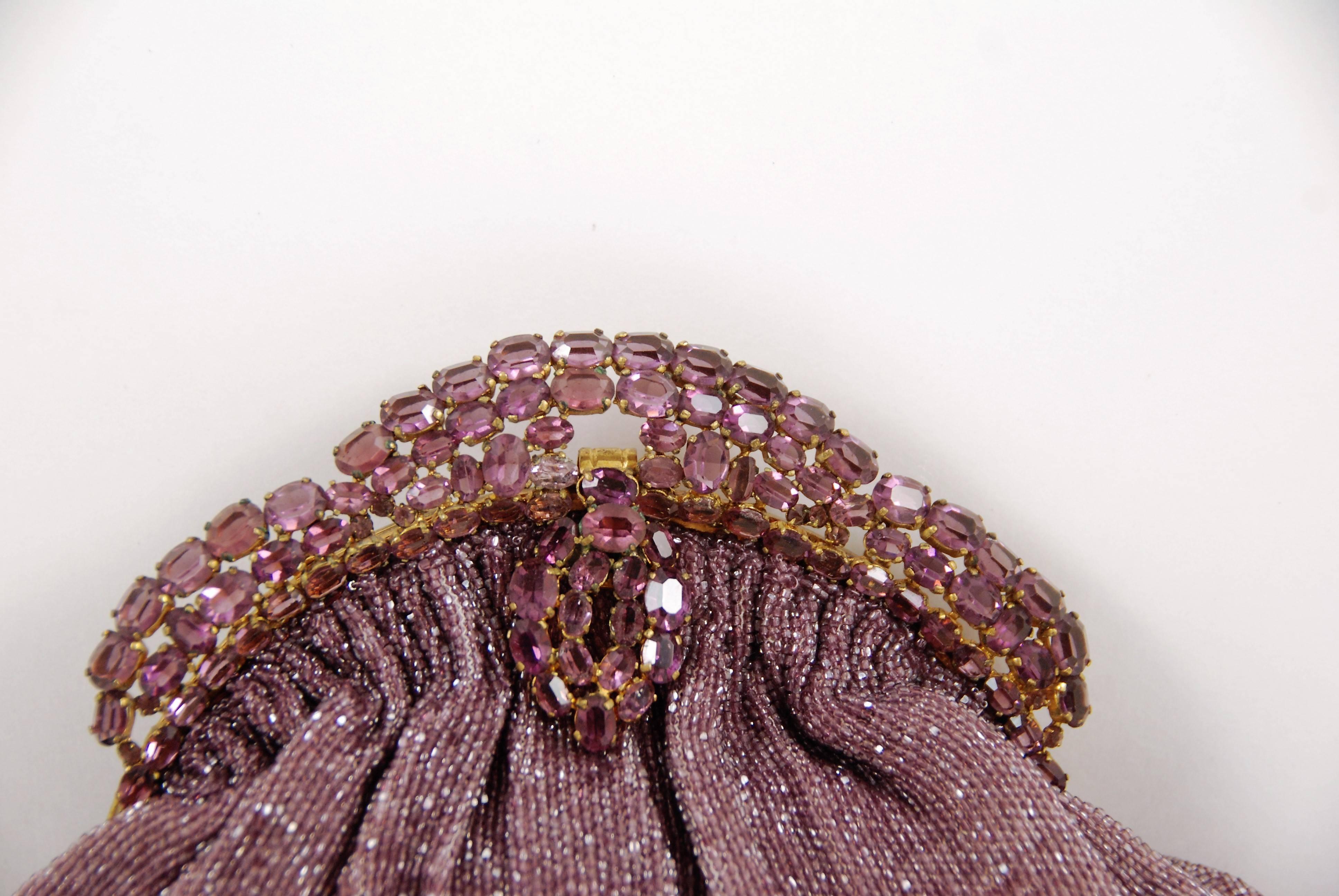 Vintage Josef (tag is missing but I have had these bags before) evening bag in an amethyst color beaded and a jeweled frame of faux amethysts. The frame is reminiscent of a tiara and all the stones are prong set. The amethyst colored beads have