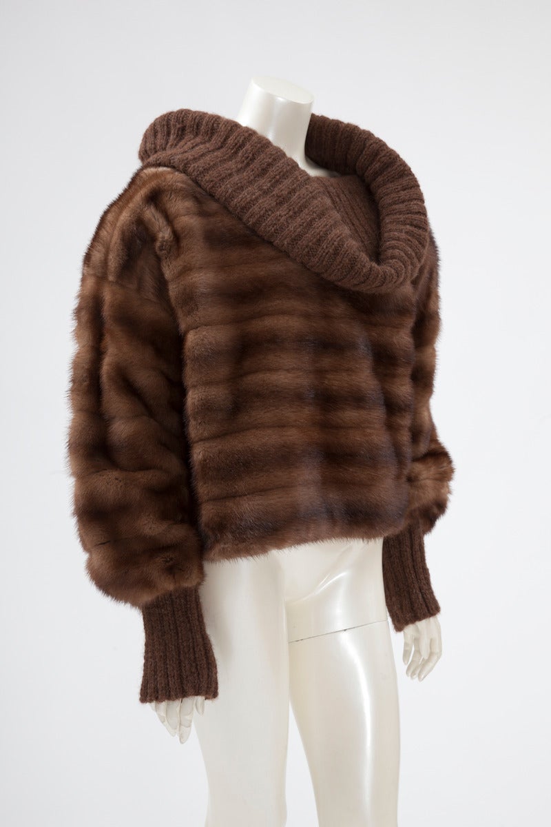 Wear this unusual late 80's - early 90's Fendi mink & ribbed wool pullover-coat on top of your favorite top and jeans for an effortlessly chic relaxed style. Large turtleneck collar. Fully lined in color-matched silk. Shoulder pads removal possible