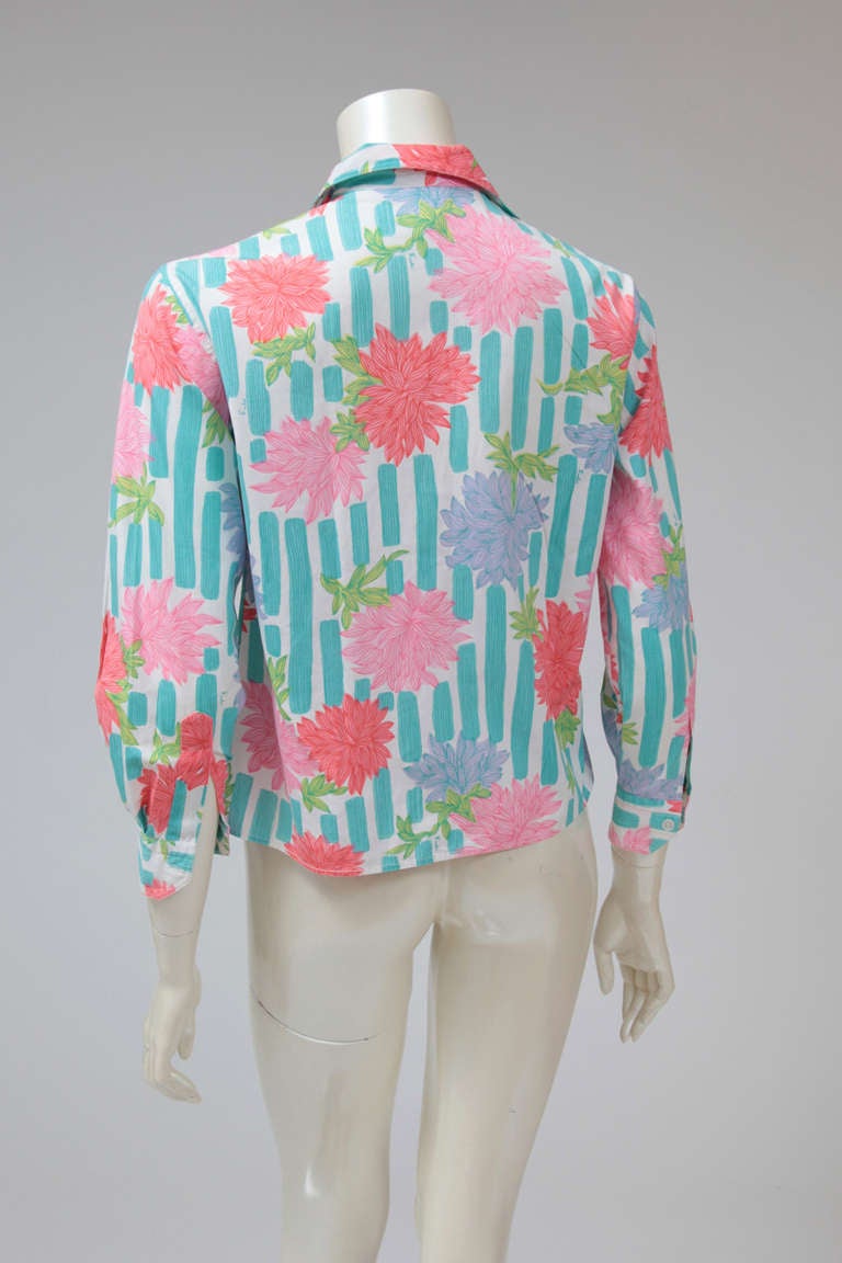 Charming early 70’s Pucci cotton shirt featuring a lovely peonies print. Four front buttons.

Fits approx. : US 2-6 / FR 36-38

Measurements (taken flat) : 
Width (shoulder to shoulder) approx. 41 cm (16.1 inches) 
Width (armpit to armpit)