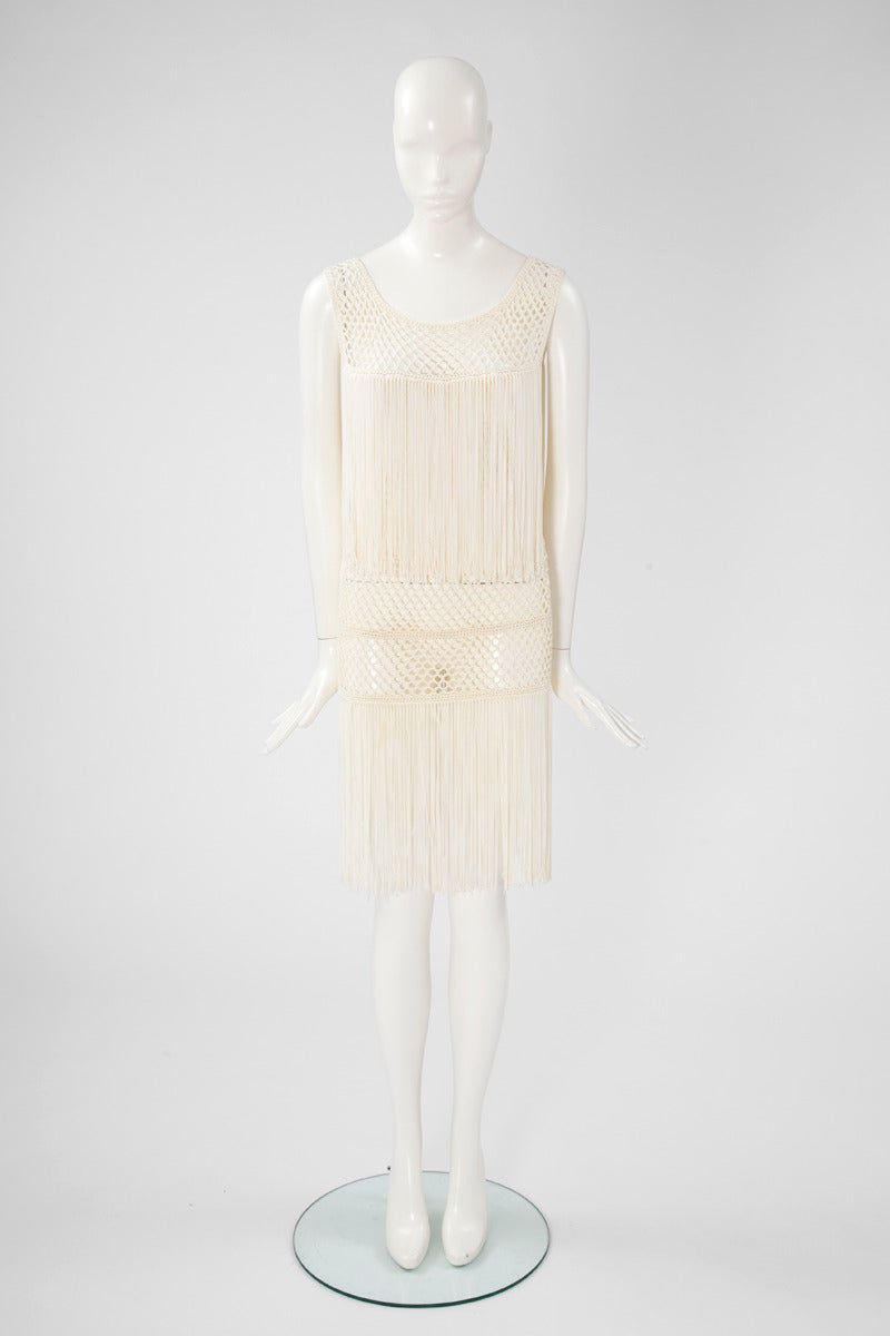 In the 20's mood, this 80's Valentino ivory crochet & fringed flapper dress is fun and sexy. Dress is unlined, pull on style with no fastening. Size M.

Fits approx. : US 2-6 / FR 36-38 

Measurements (taken flat) :
Width (armpit to armpit not