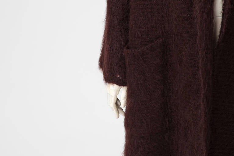 Jean Paul Gaultier for Hermes dark burgundy mohair, wool and polyamide coat with shawl collar. Refined openwork details at the hem and at the cuffs (see pictures 3 & 6). The coat is entirely lined with a refined dark burgundy 