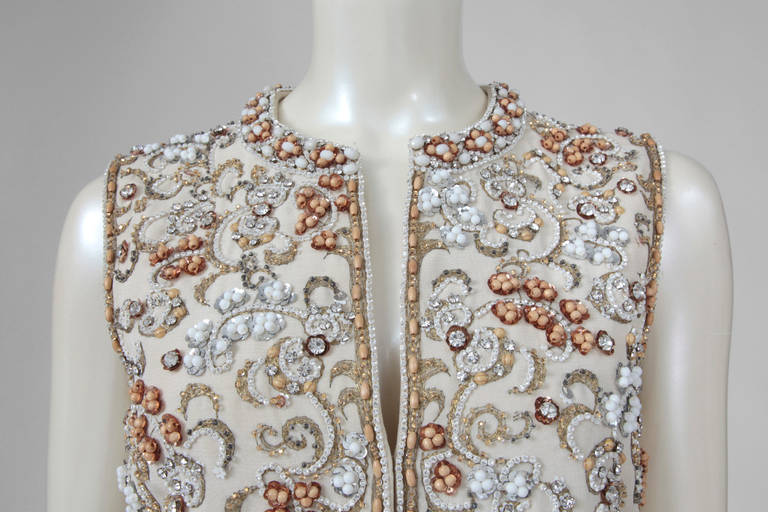 Extraordinary late 60's - early 70's Valentino haute couture waistcoat-mini dress. Has a XVIIIth century Golden Age flavor, with opulent intricate embroidery featuring refined wooden pearls, white resin beads, bronze sequins and delicate rhinestones