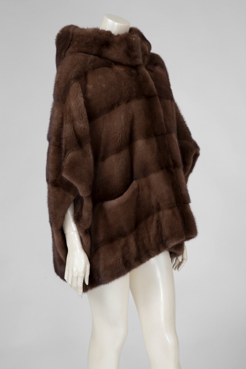 Beautiful Yves Salomon very light female mink coat, with cape effect. This hooded coat closes with hooks down the front. Two large pockets. The size tag inside the coat is a FR 38 (US 4-6) but thanks to the oversized cut, it will easily fit a size L