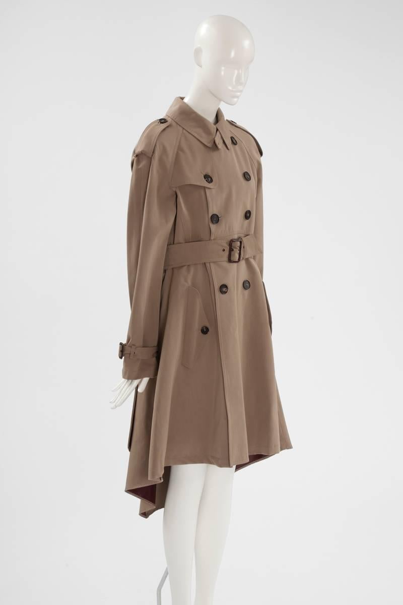 Year after year, Gaultier was reinterpreting, with his characteristic twist, his essential tailored trench coat. It has therefore become a classical of the brand. Cut for a slimming look, this Fall-Winter 2007-2008 never worn runway piece (look 9)