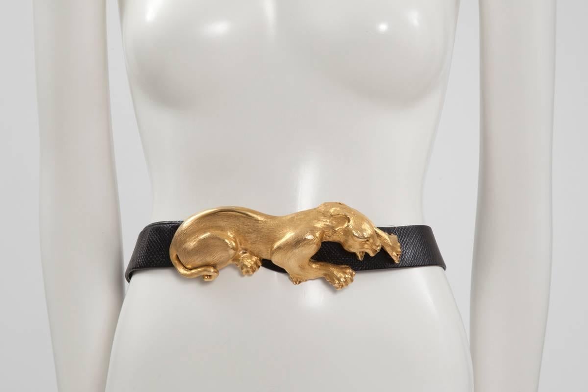 Spectacular 80’s Christopher Ross black embossed leather belt with a golden metal hand-sculpted croucing panther. The back side of the buckle is stamped “Christopher Ross c 1985” and signed by the artist with his signature thumbprint. We do love the