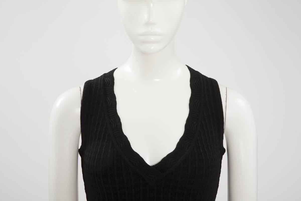 An Alaïa “Little Black Dress” dress will never go out of fashion ! Especially this 1992 viscose knit dress with semi sheer crochet-work detail. Unlined, this piece nips in at the waist, features a V-neckline and has hidden snap closure shorts under