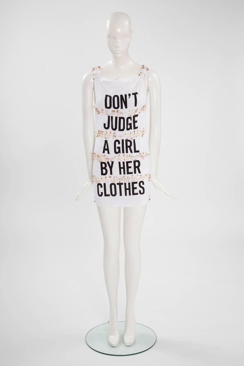 Humorous creations were one of the characteristic of Franco Moschino. Julia’s Dressing is pleased to offer this safety pin cotton mini dress which reflects the Punk movement in a funny sexy provocative way. Labeled an Italian size 40 (US 6).

Fits