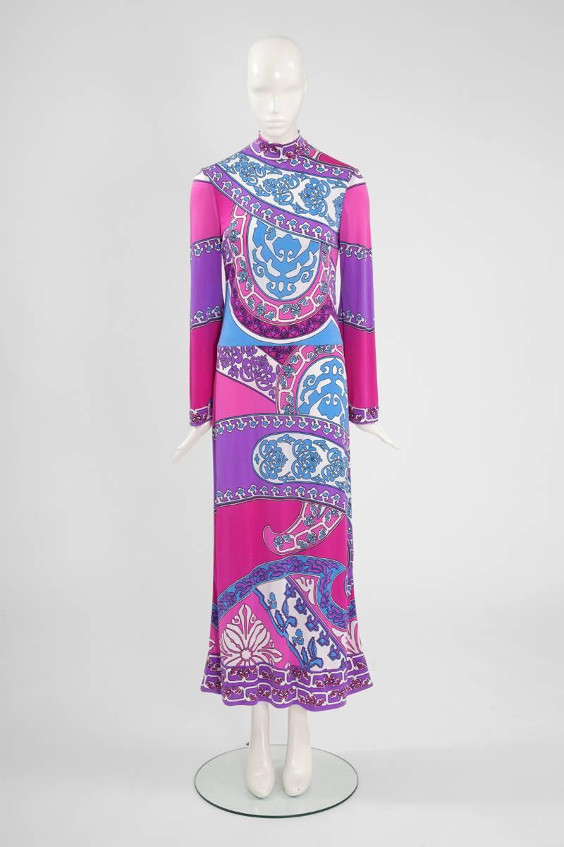 This stunning early 1970's Leonard psychedelic print maxi dress will make a great addition to any modern summer wardrobe. Fuchsia, lilac, pink, turquoise and white make a striking palette. Unlined, this high neckline dress comes with its matching