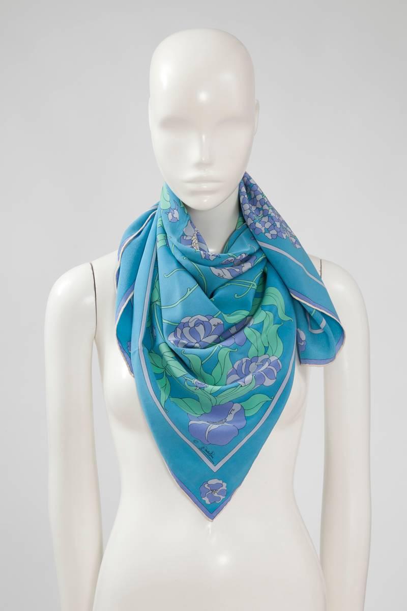 60's Emilio Pucci silk scarf with a lovely and unusual floral pattern. Rolled edges. Emilio Pucci’s signature is printed throughout the scarf. A great addition to any Pucci scarf collection or just drape it over a white tee or blouse for a polished