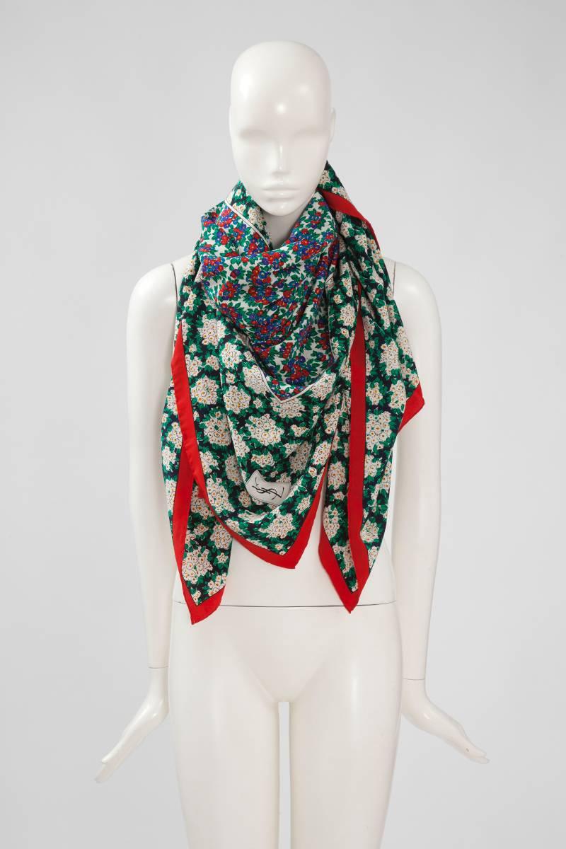 This wonderful vintage large YSL stole beautifully patterned with vibrant bunch of flowers, is an effortless way to give any outfits a feminine, romantic feel. Cut from beautiful lightweight silk, it’s large enough to be draped  over a coat or