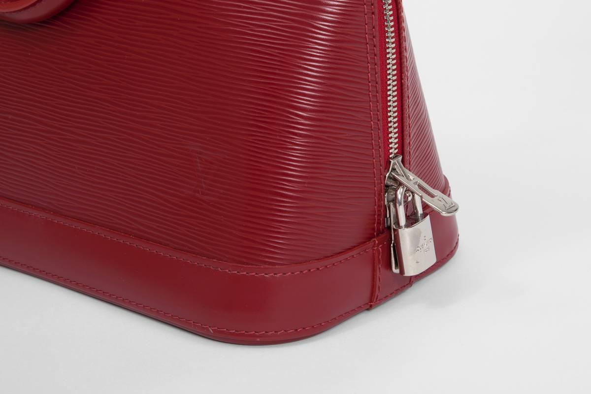 Red Nearly New Louis Vuitton Alma Handbag 