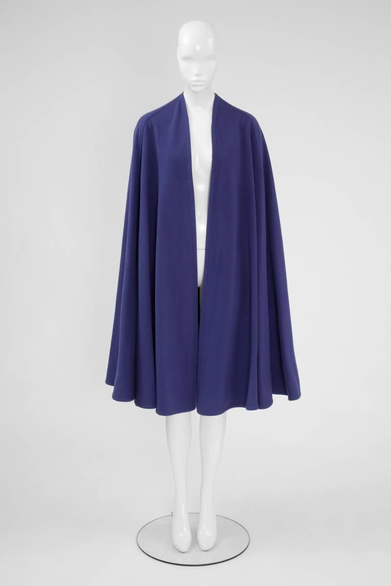 A wonderful alternative to a winter coat, this 70’s YSL cape is a practical yet chic piece. Made of lilac wool, it has no fastenings and needs only to be placed on the shoulders. Unlined, the cape is a vintage French size 34 (US 0) but fits multiple