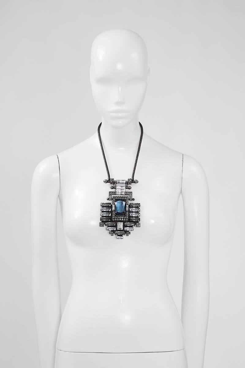Lanvin jewelry by Alber Elbaz can transform the simplest outfit into something stunning ! This runway (look 24) magnificent gunmetal-tone necklace features a sculptural pendant inlaid with Swarovski crystals that catch the light from every angle.