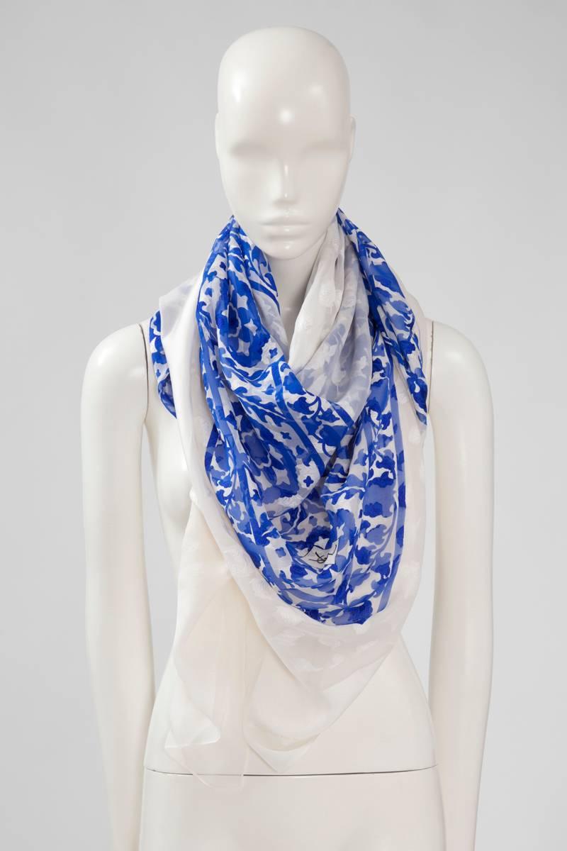 Reminiscent of the cobalt blue and white “azulejo” from Portugal, this vintage large YSL stole is a lightness and softness dream. Made in a refined jaquard silk chiffon, it measures 120 x 120 cm (47.2 x 47.2 inches). Not easy to picture - because of