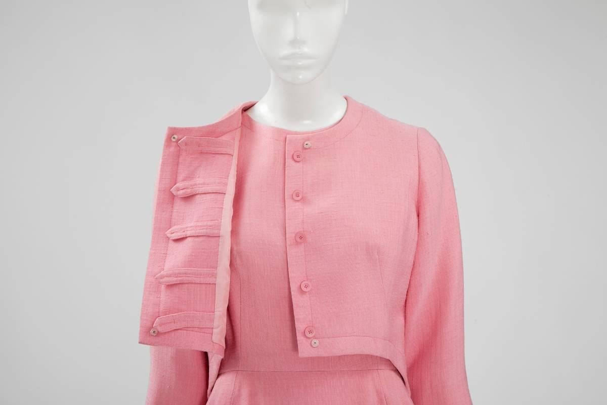 A versatile piece of haute couture, this 60’s Nina Ricci dress suit can be worn as a set for a very chic coordinated look or alternatively, the jacket can be teamed with jeans or trousers for a more casual look. Constructed in pink linen, the