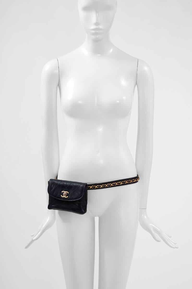 Late 80’s - early 90’s dark blue quilted lambskin belt bag accented with gold tone hardware. The adjustable belt is embellished with the recognizable classic Chanel gold metal and leather chain. CC turn lock closure at flap. The waist pouch is fully