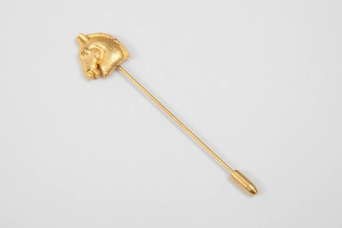 Rare gilt metal Hermes horse head pin. The pin is signed 