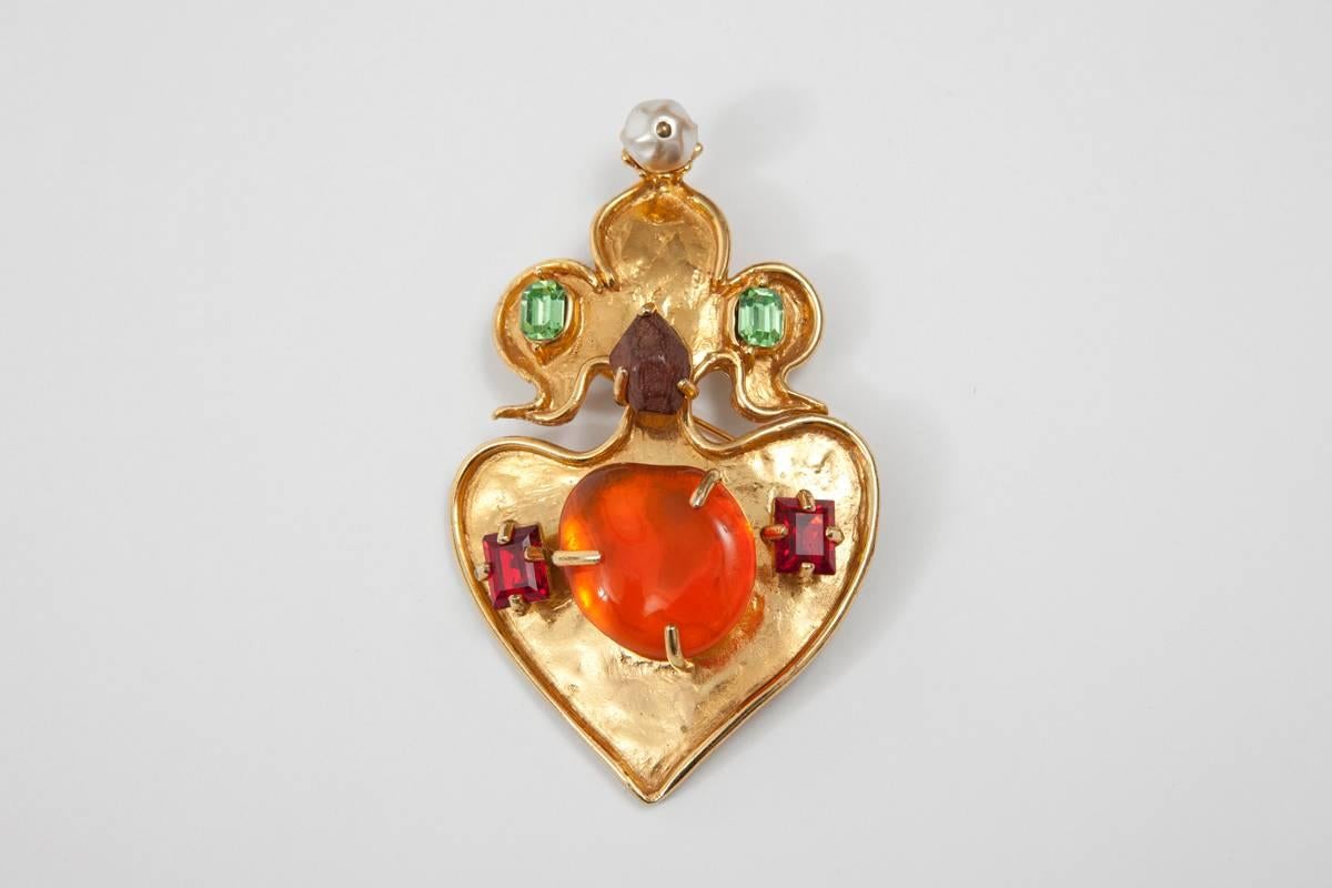 90's signed Christian Lacroix brooch. Bright colorful stones, wood and faux pearl in a gold-toned setting. To be worn casual on a military jacket or smart on a silk blouse or a pullover !

Dimensions :
Height approx. 9.5 cm (3.7 inches)
Length