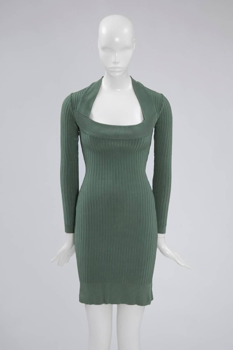 This recognizable 90's Alaïa slim-fit viscose ribbed knit celadon dress is designed to flatteringly follow the line of the silhouette. This unlined piece nips in at the waist and features a scoop collar. The dress is a size M but the stretchy