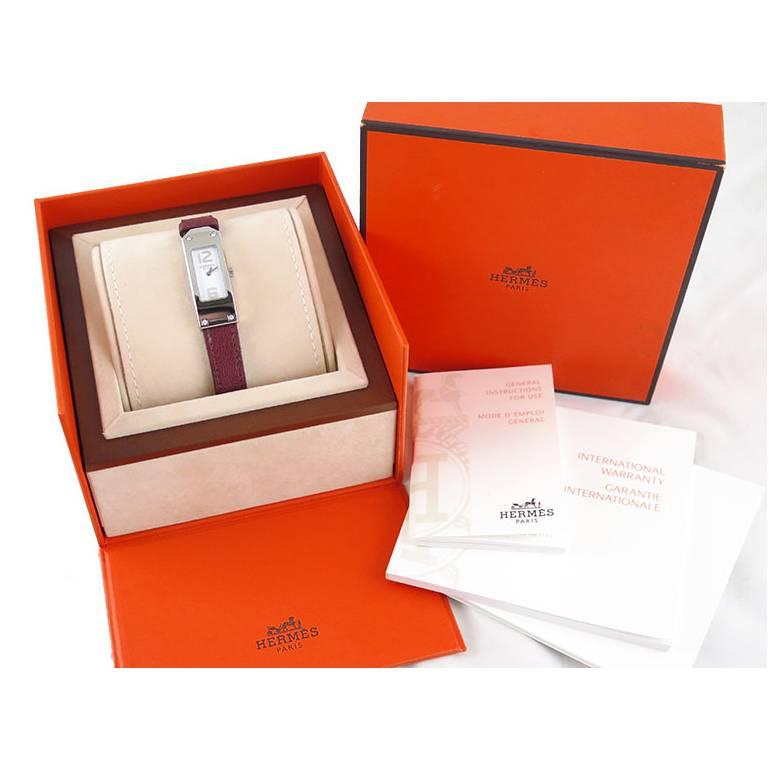 Rarely available in diamonds. This piece is in excellent condition and comes complete with original Hermes watch box and papers. Swiss made, quartz movement. Stainless steel case with white dial and no glare sapphire glass studded with one diamond