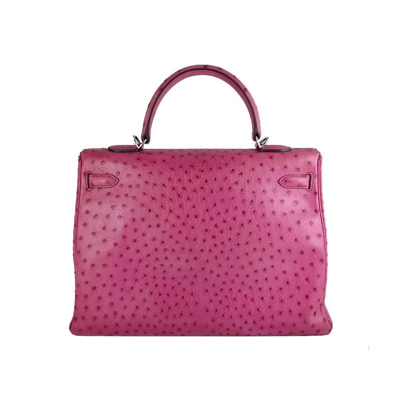 Fresh out from spa! Highly sought after hot pink fuchsia colour in ostrich! This piece comes complete with Hermes dustbags, shoulder strap, clochette, 2 keys, lock and spa receipt. Protective seals on the hardware are still intact. Features 1