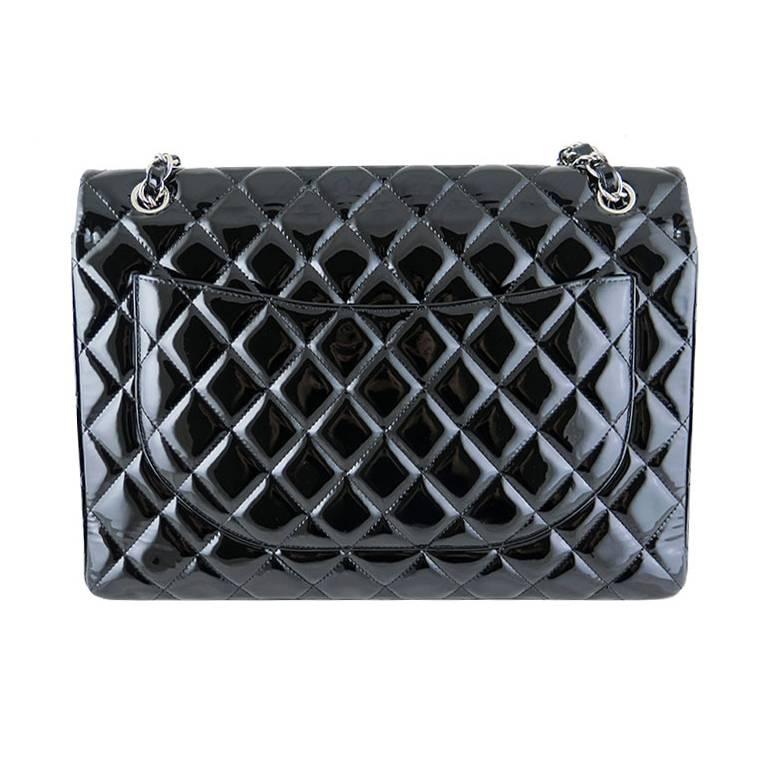 This piece comes complete with original Chanel box and dustbag. It is in excellent condition with no visible stains and scratches. Patent leather is smooth to the touch. Silver chains and hardware are shiny with no tarnish. Straps can be worn long