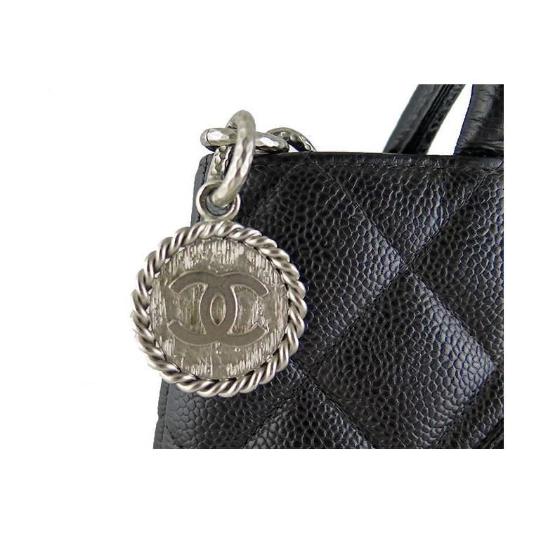 Caviar leather is very durable hence there are no visible stains or scratches on the exterior hardware. Features a back pocket and 2 interior pockets- one zippered and one slot. Silver hardware is shiny and has no fading or tarnishing. Interior is
