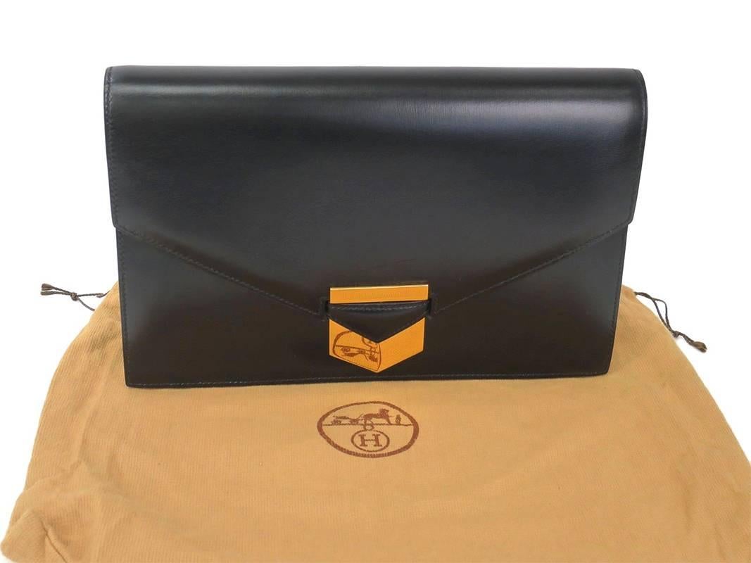 Rarely available as this model has been discontinued by Hermes. This piece comes with original Hermes dustbag. It is well kept and in excellent vintage condition. The clutch can be carried as it is, or used with an Hermes scarf looped under the flap