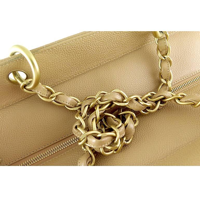 Caviar leather is very durable hence there are no visible scratches on the exterior leather. Gold chains and other hardware do not show signs of fading or tarnish. Leather straps are in good condition and not worn out. Features an inner zippered