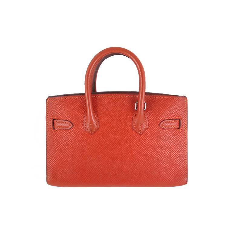 Extremely rare piece! Collector's item. This tiny birkin comes complete with original Hermes box, dustbags, shoulder strap and care card. It can be worn on your waist with the shoulder strap as a belt, slung around your birkin or kelly handles as an