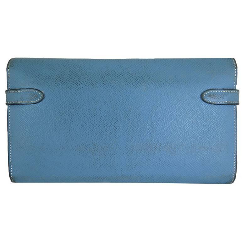 Dirt is present on the front and back of the wallet. It can be taken to a Hermes store for spa or sent to a leather professional to have it recoloured to original colour. Interior is clean and odourless. Features 12 credit card slots, 2 billfold