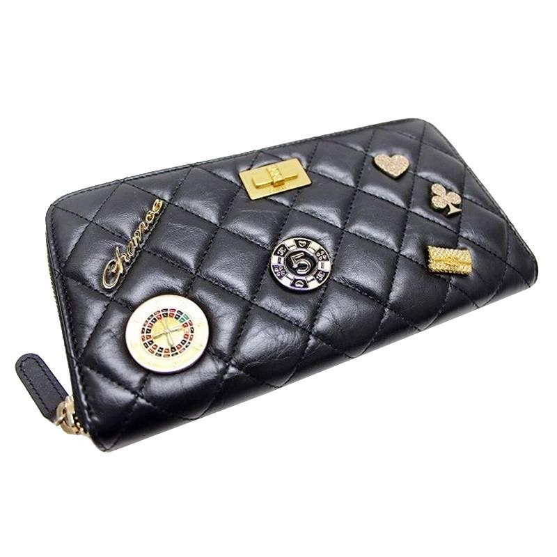 This piece comes complete with original Chanel box, dustbag and authenticity card. It is from the 2016 collection. There are 8 credit card pockets, 2 bill compartments and a zippered coin compartment. Serial number is intact and matches the